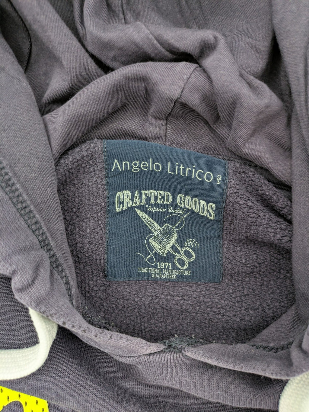 Angelo Litrico grey hoodie with neon green 'Real Goods Co NYC' graphic print and kangaroo pocket.