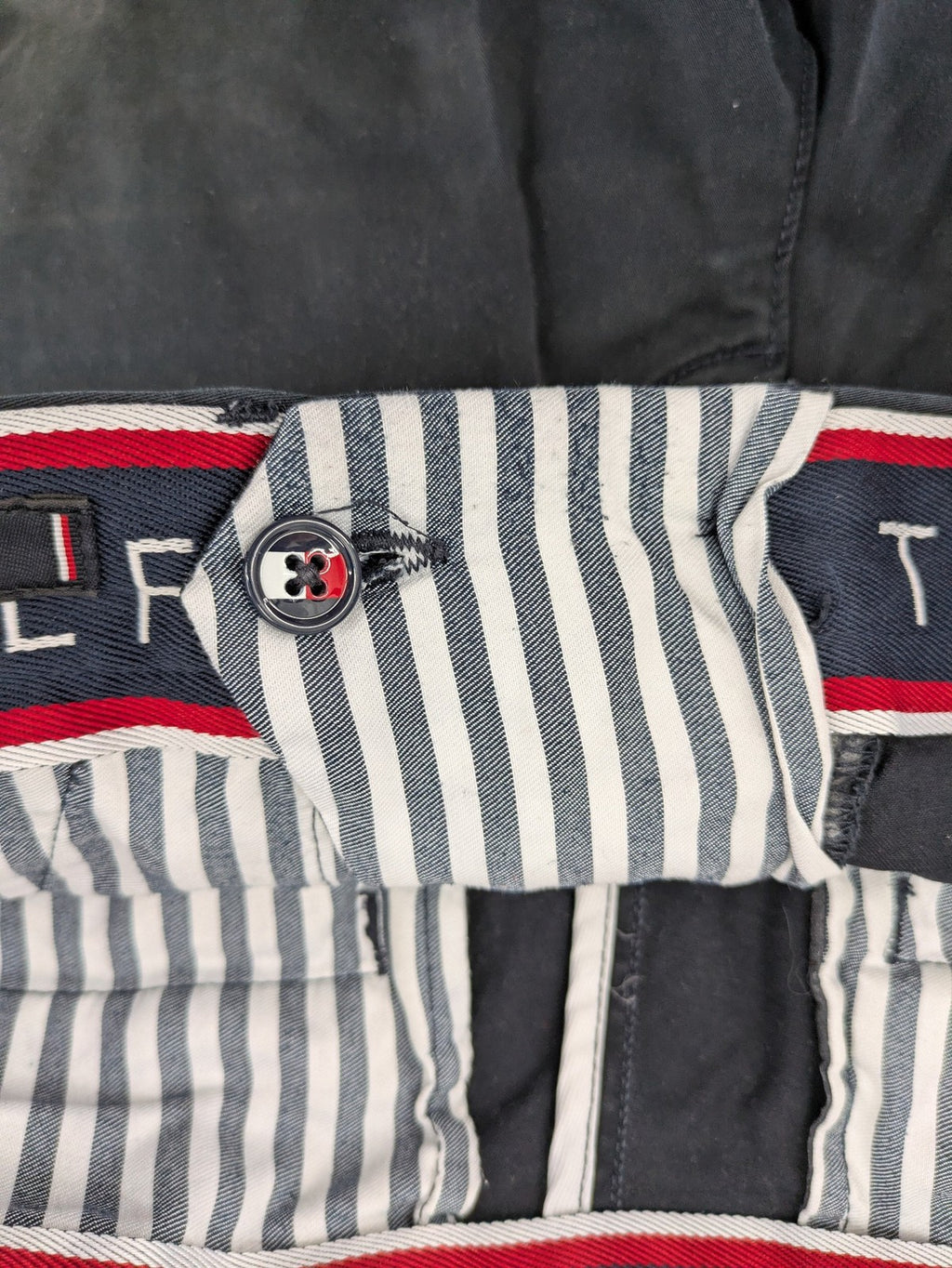 Tommy Hilfiger grey chino pants with TH-Flex stretch technology and classic straight fit design.