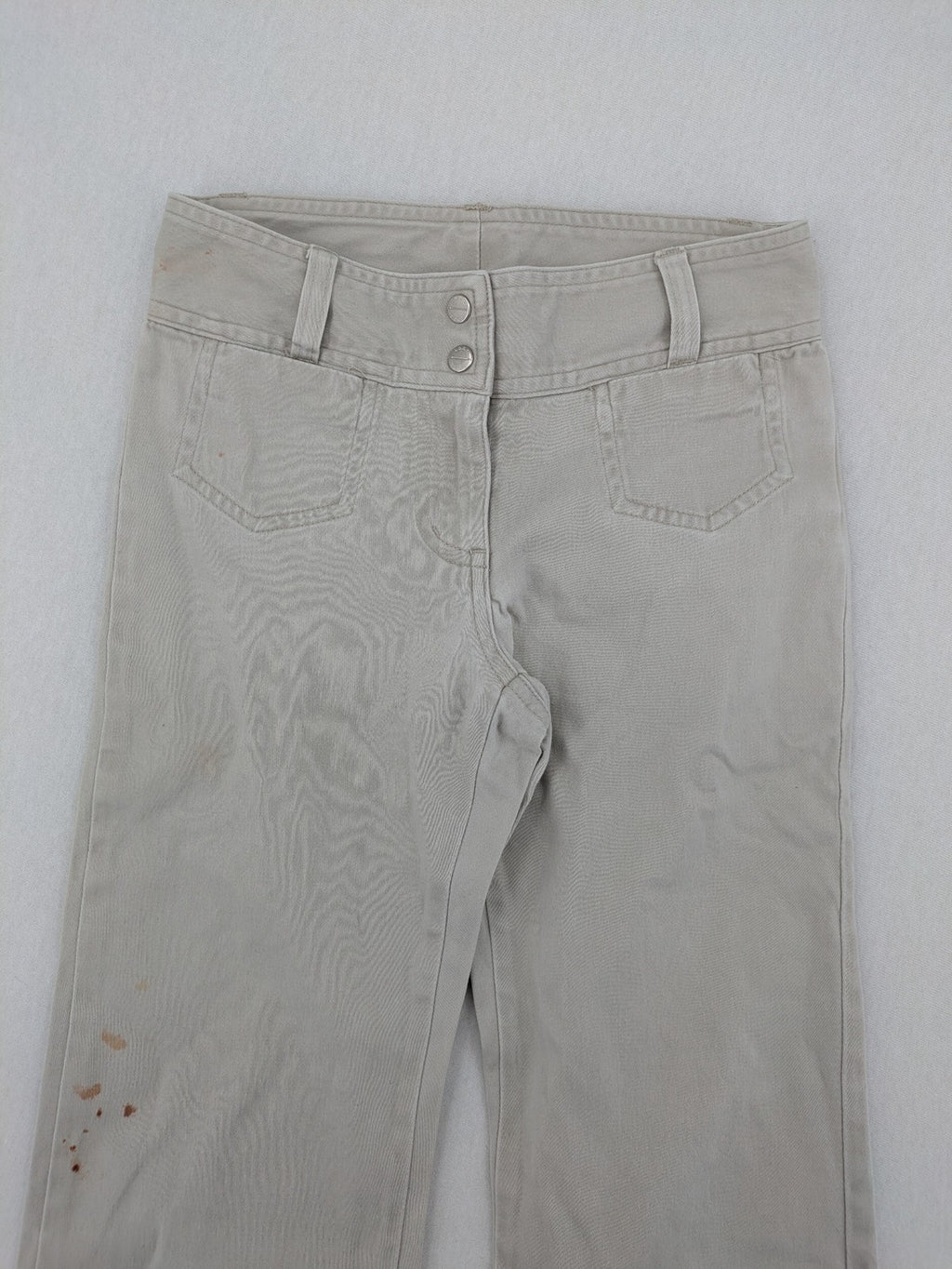 H&M L.O.G.G beige bootcut pants with double button closure and stretch cotton material.