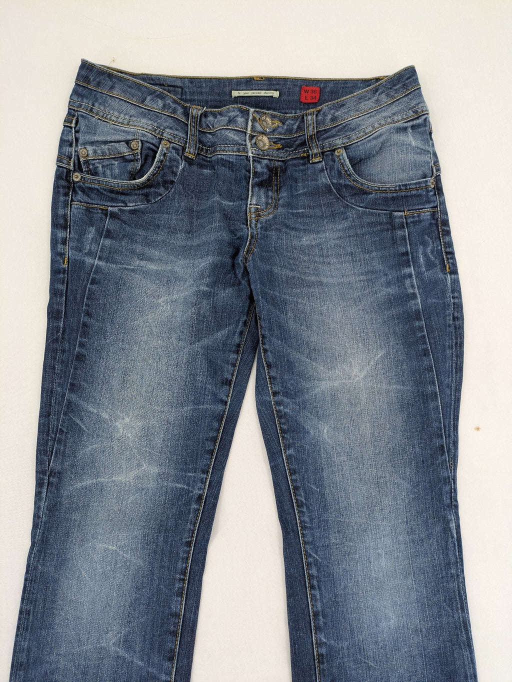 QS by s.Oliver green straight jeans five-pocket design with unique double button closure