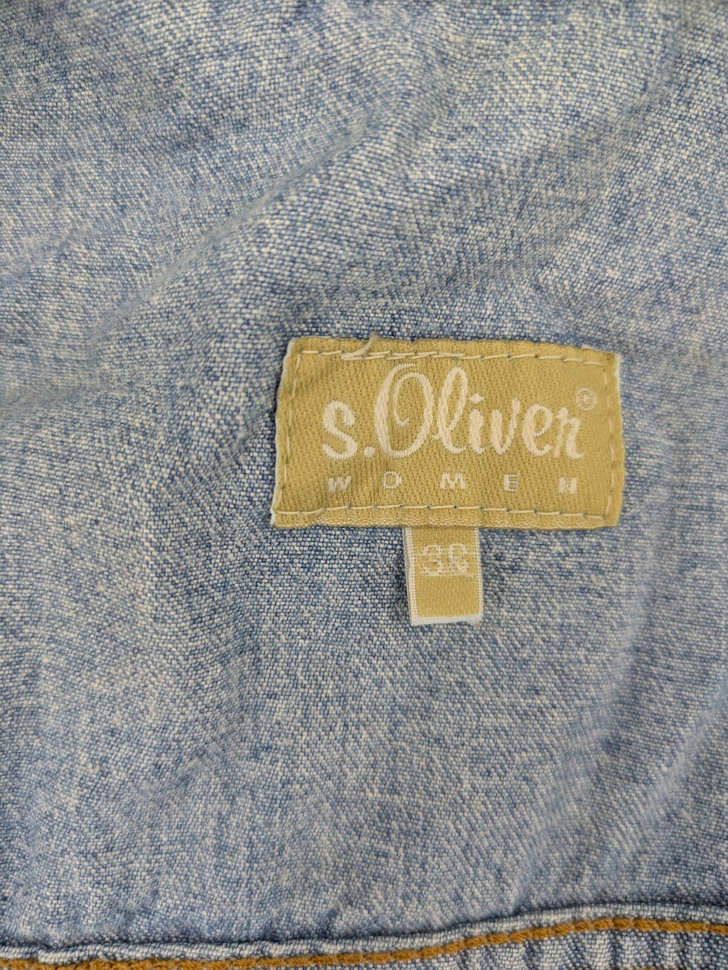 s.Oliver blue denim vest with button closure, pointed collar, and breast pockets.