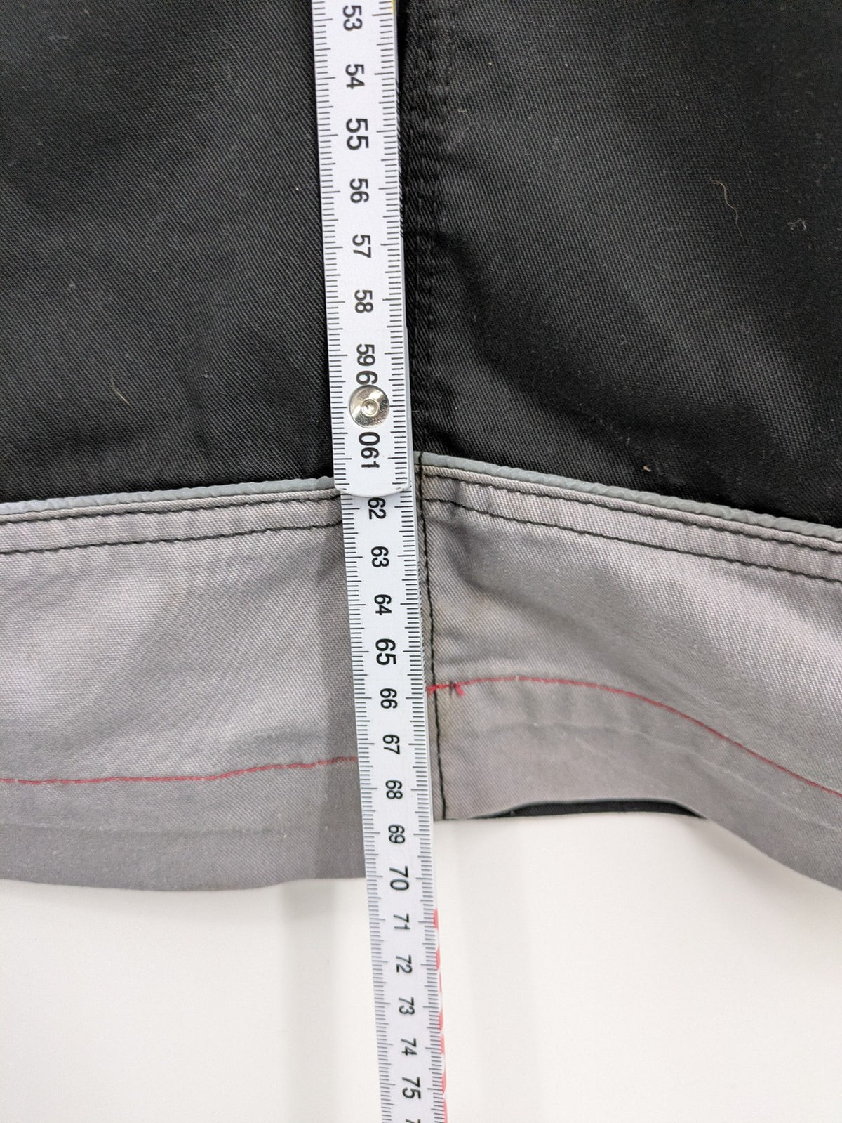 Cargo pants black grey two-tone design with red stitching and multiple pockets
