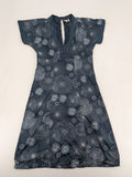 Muster navy dress with white abstract dandelion print, V-neck and collar details.