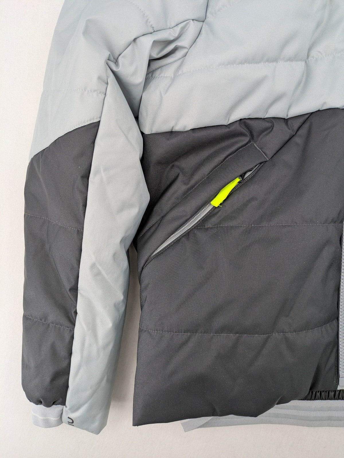 Wedze ski coat grey and black colorblock design with neon accents and fleece lining.