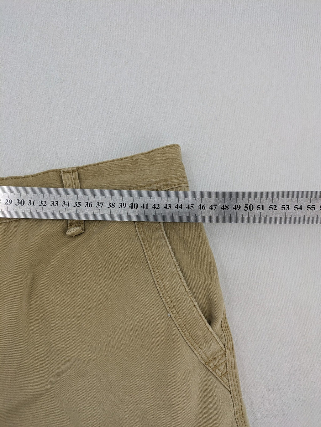 Angelo Litrico beige cargo shorts with multiple pockets and durable cotton material.