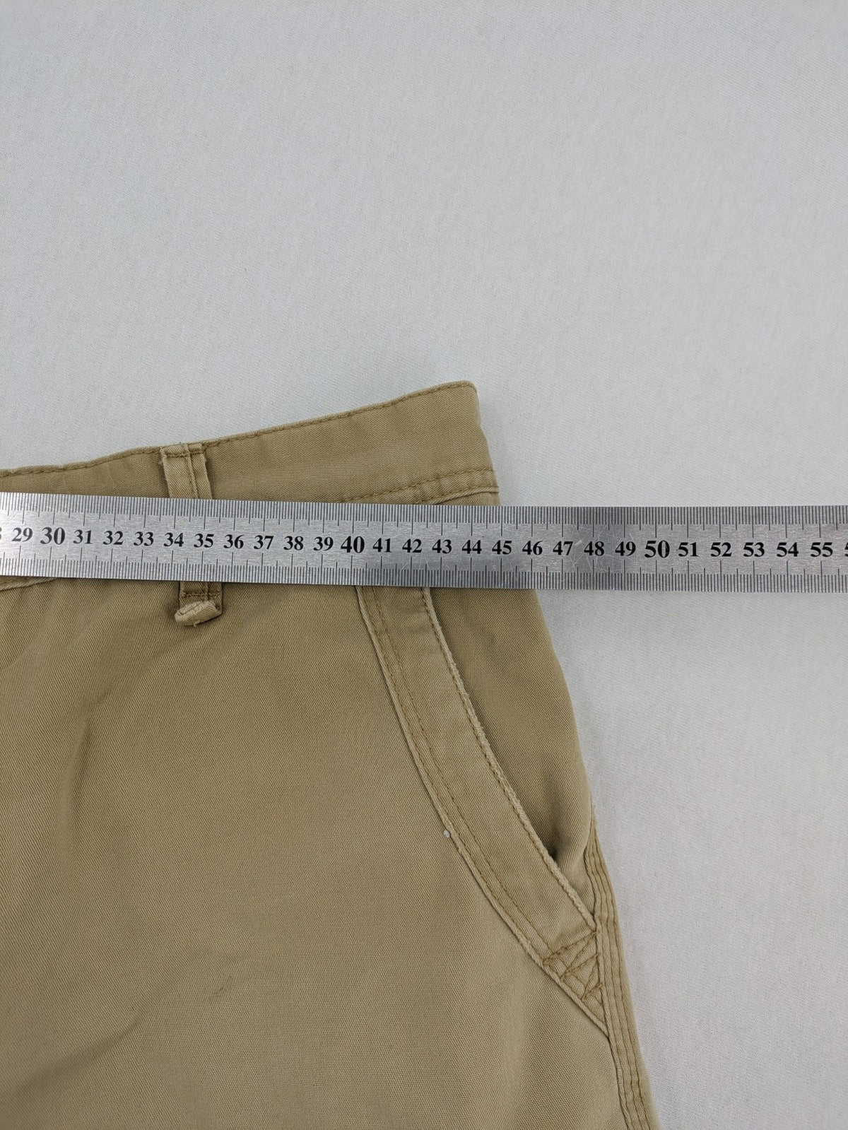 Angelo Litrico beige cargo shorts with multiple pockets and durable cotton material.