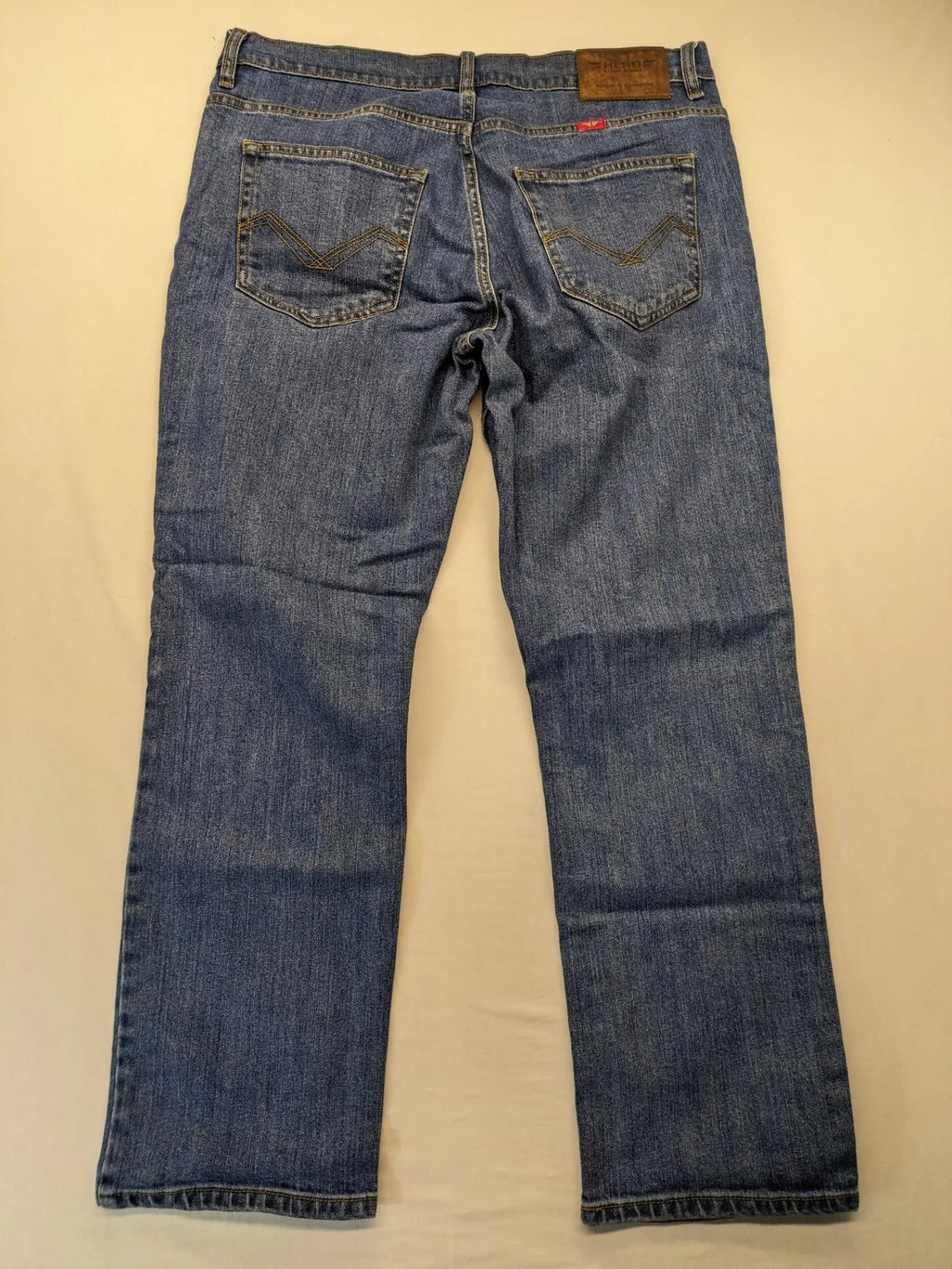 Hero By John Meddox blue straight jeans with five-pocket design and zip fly.