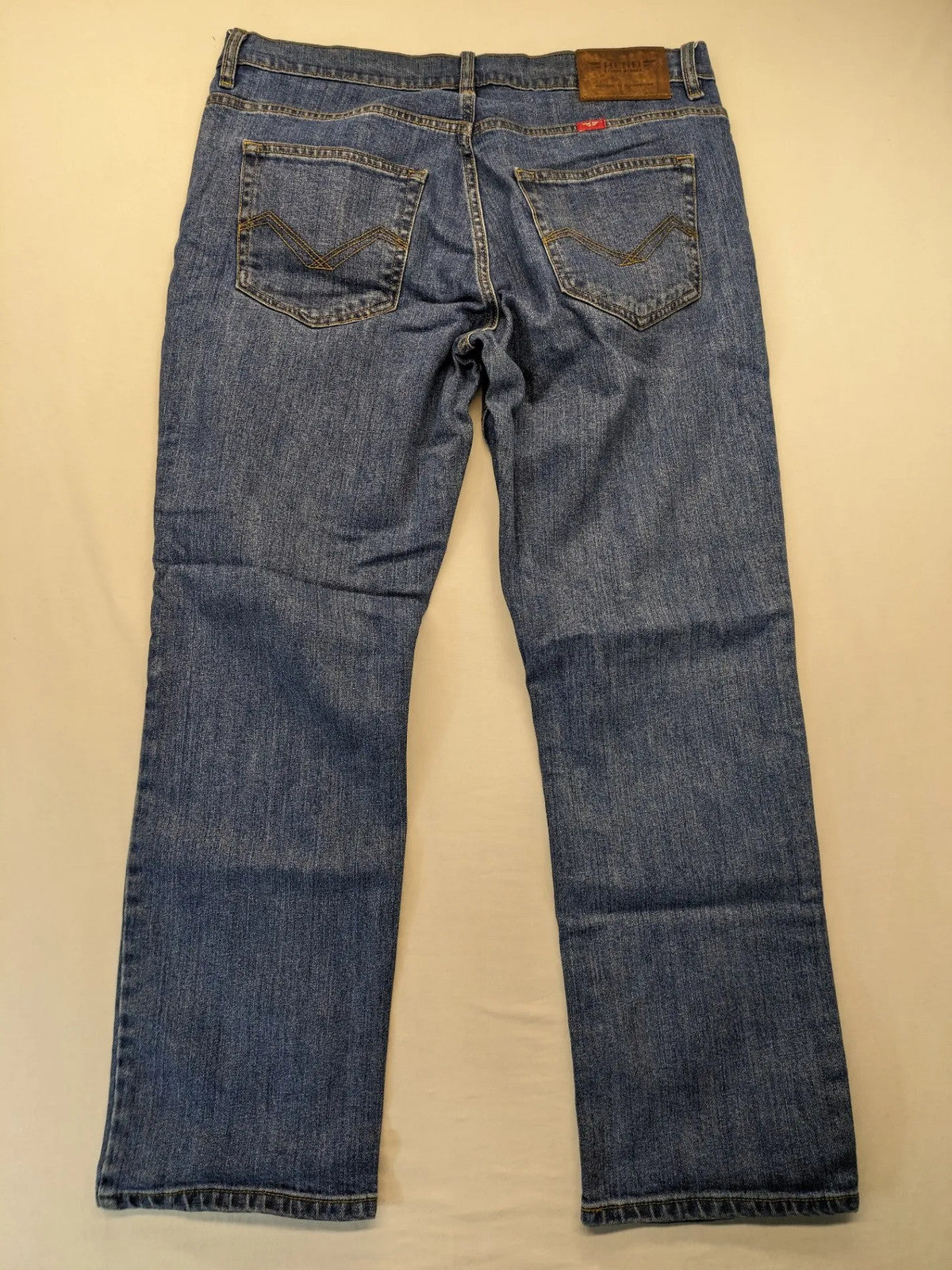 Hero By John Meddox blue straight jeans with five-pocket design and zip fly.