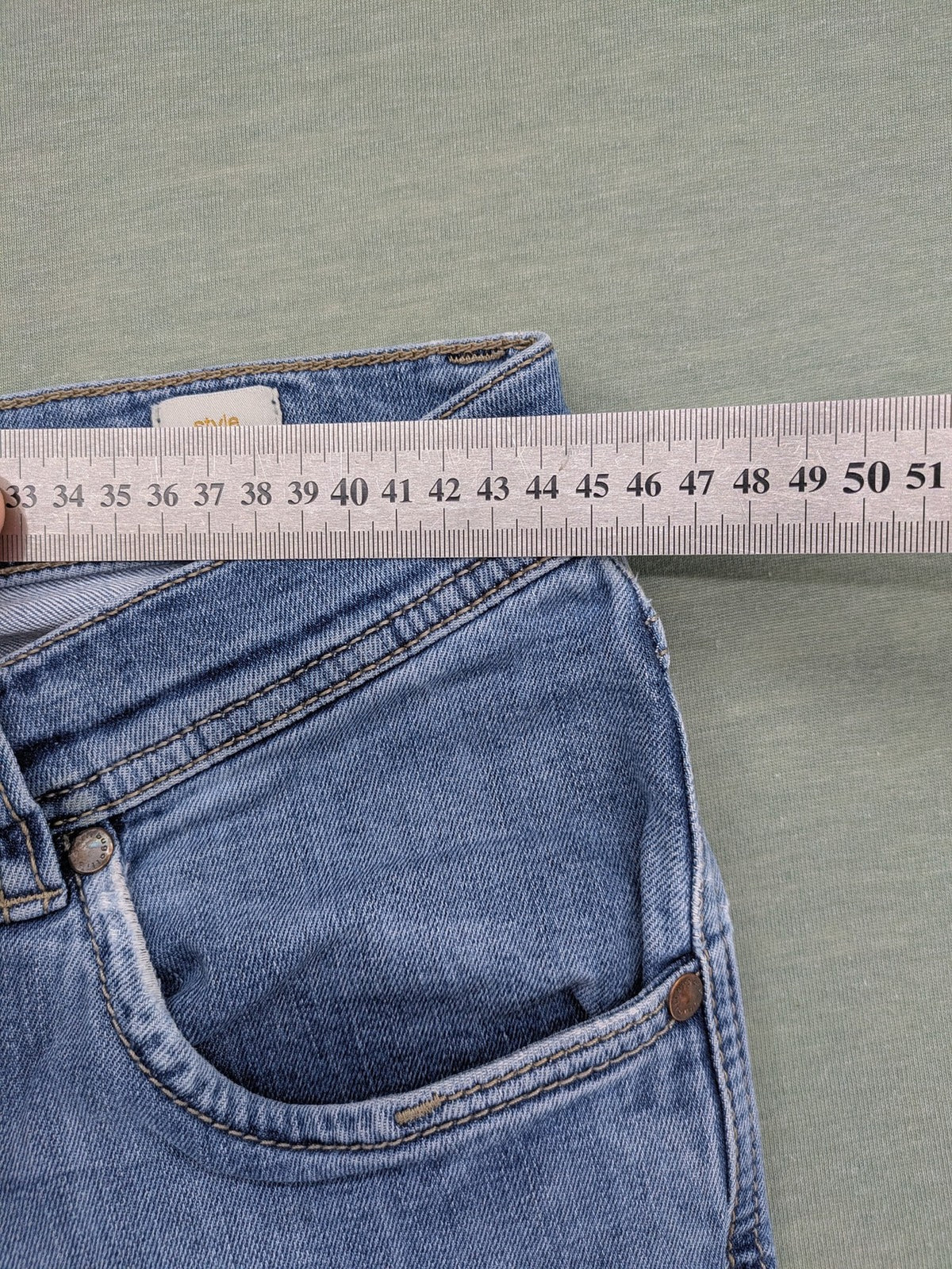 Bugatti blue straight jeans with classic 5-pocket design and light wash denim.