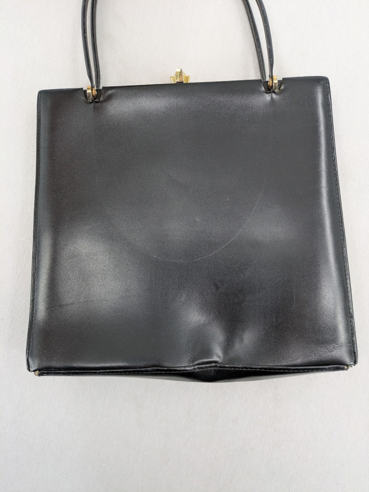 Eleganz black messenger bag vintage 50s 60s style with structured shape and gold accents.
