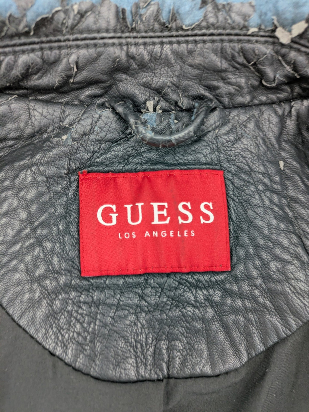 Guess black faux leather biker jacket with asymmetric zipper and multiple zip pockets.