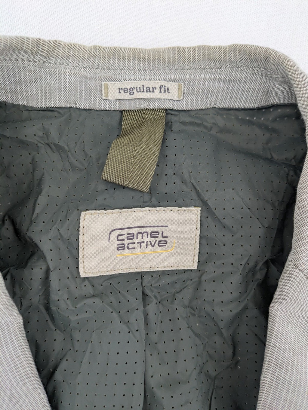Camel Active grey cord blazer with classic two-button closure and practical zippered inner pockets.