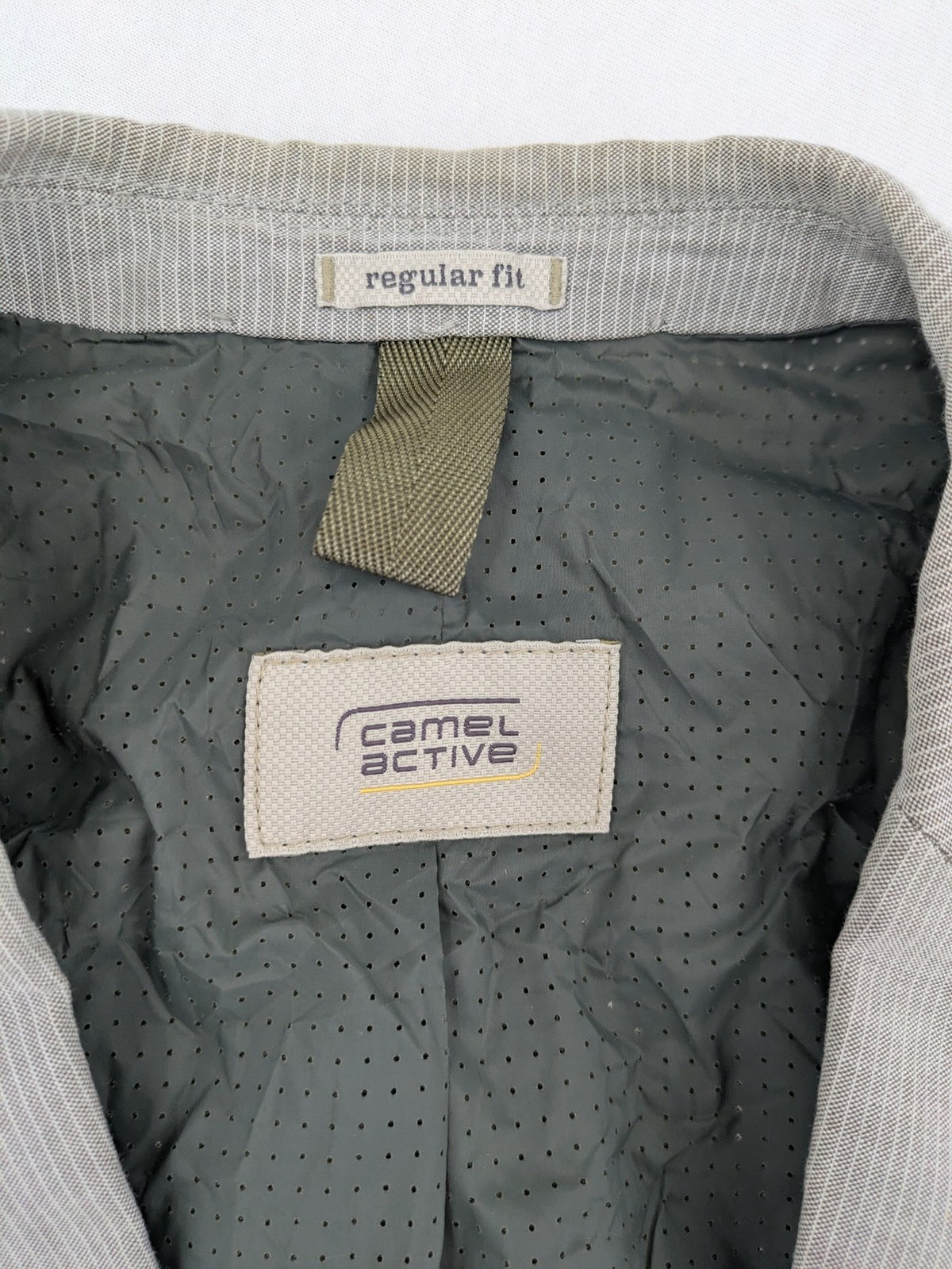 Camel Active grey cord blazer with classic two-button closure and practical zippered inner pockets.