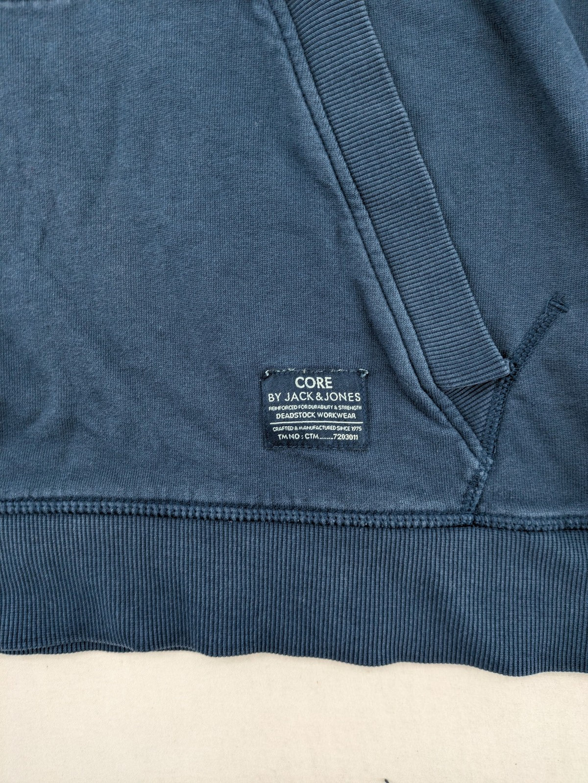 Jack & Jones Core blue hoodie with large gold "C" graphic and high collar.