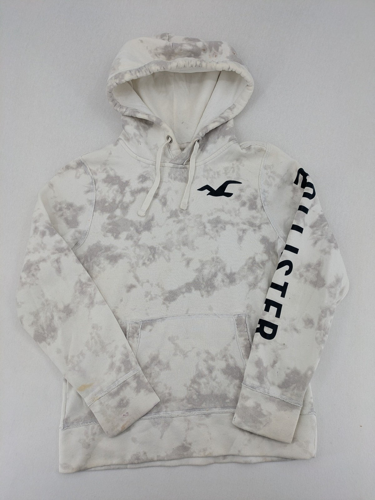 Hollister grey and white tie-dye hoodie with logo on chest, back, and sleeve.