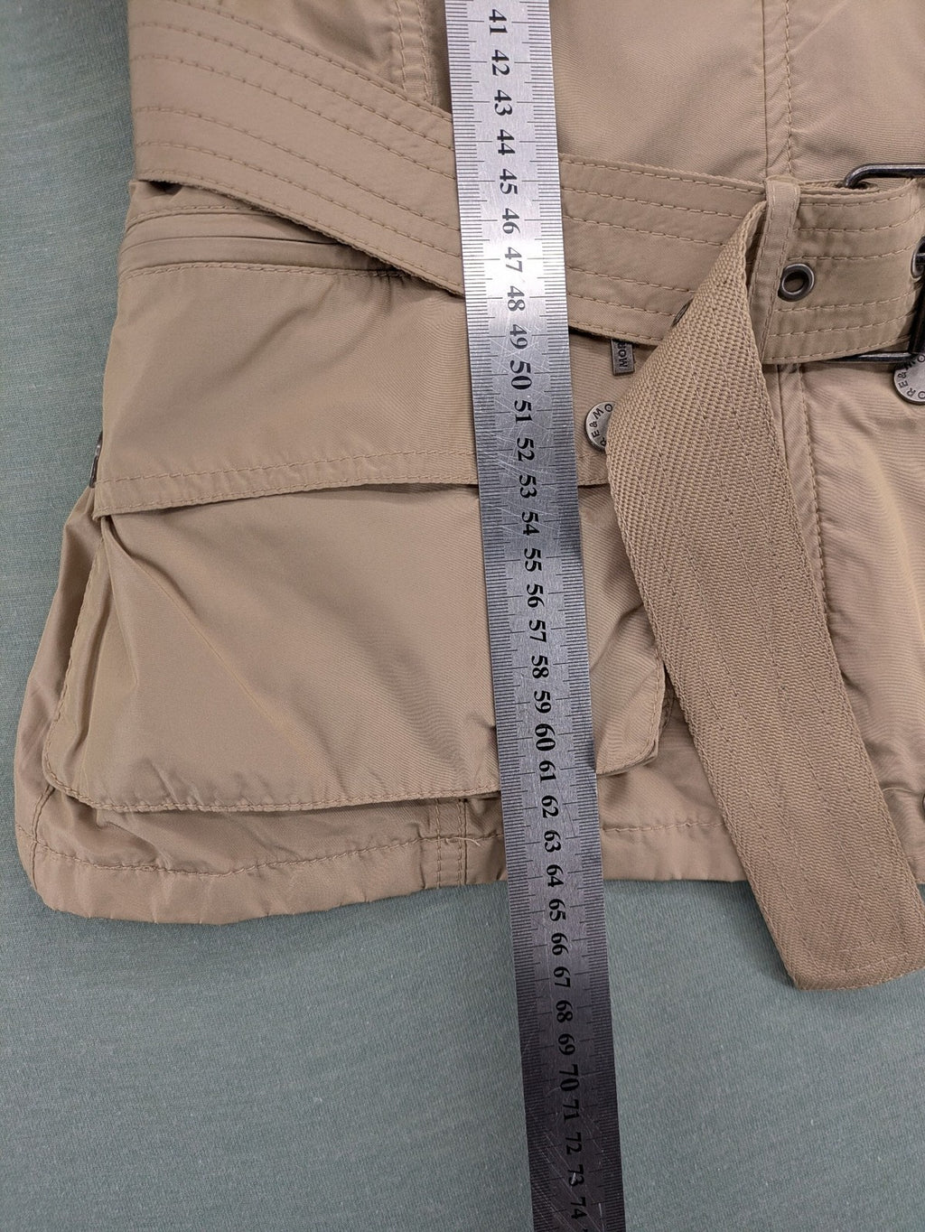 MORE & MORE beige field jacket with belt, four pockets, and standing collar.