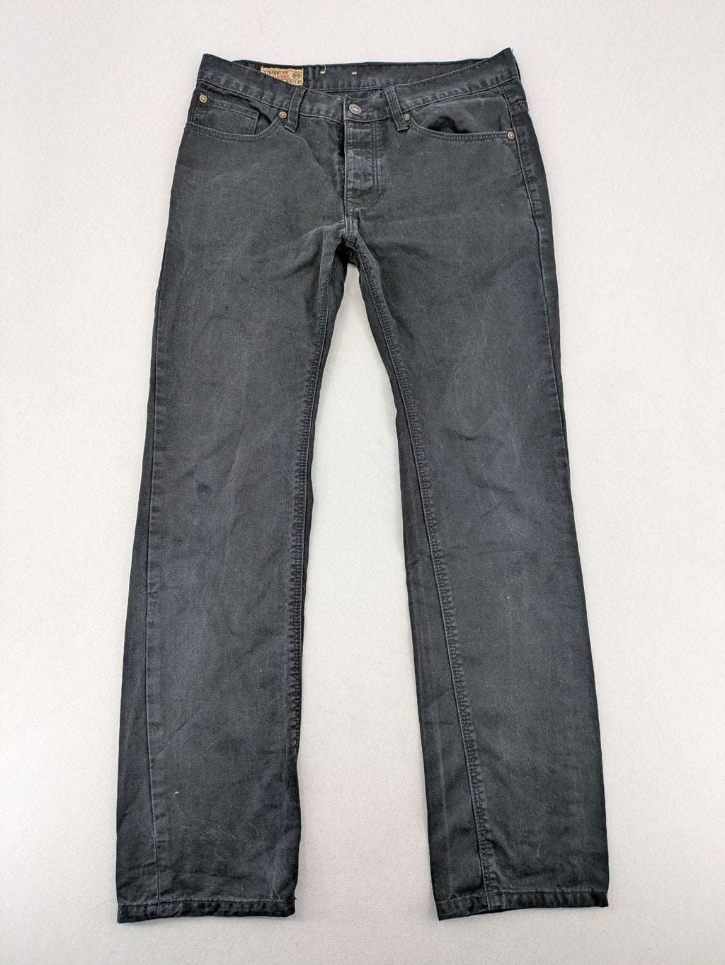 Ckh grey straight fit jeans with button fly and faded wash details.