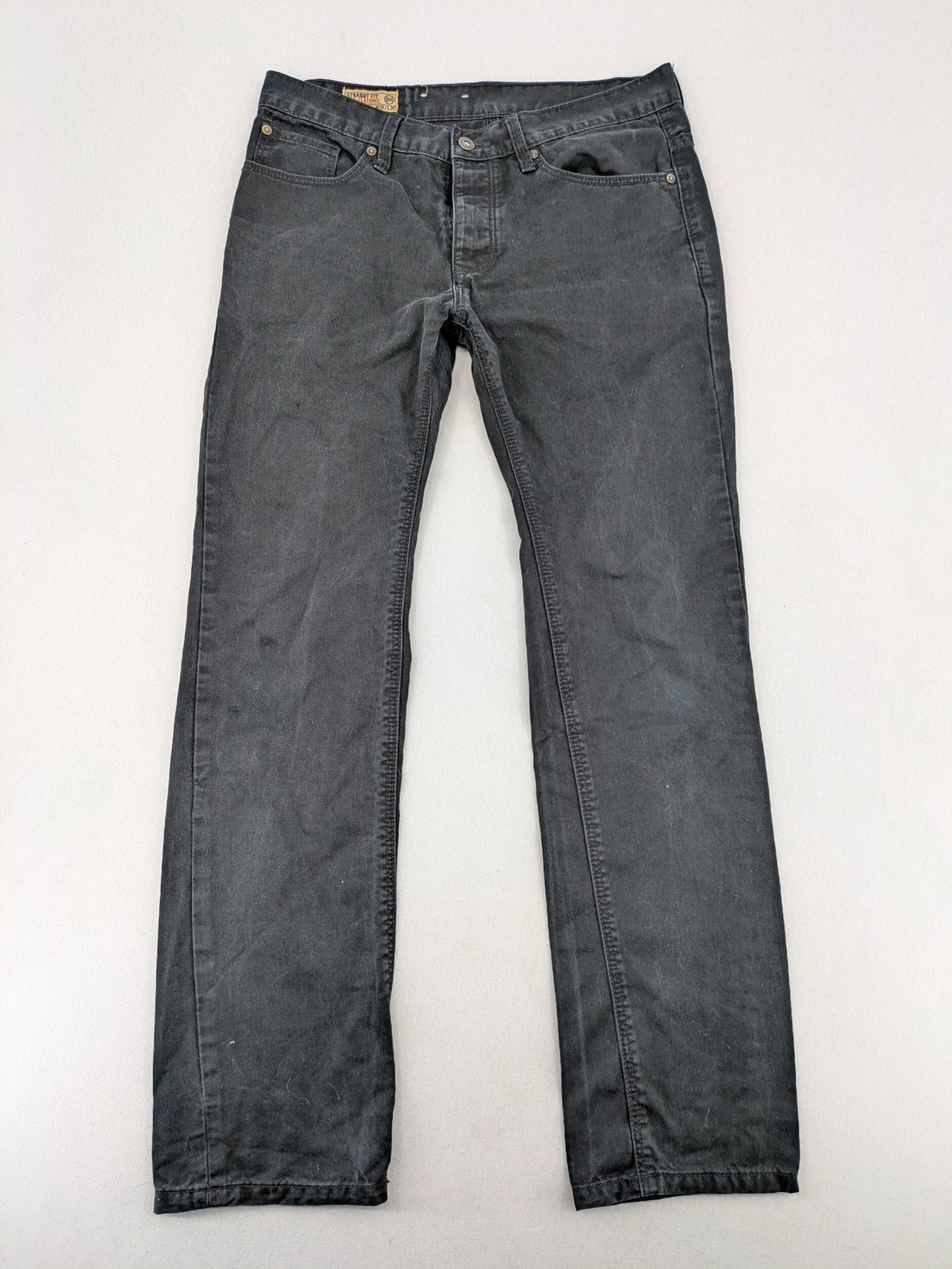 Ckh grey straight fit jeans with button fly and faded wash details.