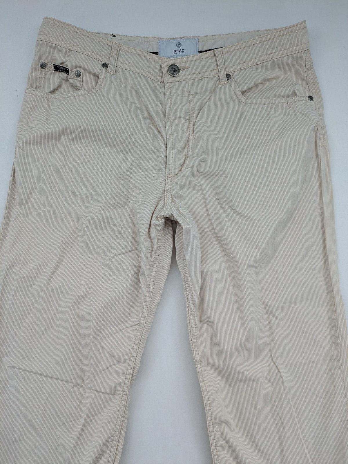 BRAX beige striped pants with logo, made from comfortable stretch cotton blend.