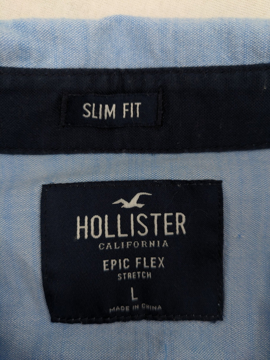 Hollister blue button-down shirt slim fit with embroidered logo and chest pocket.