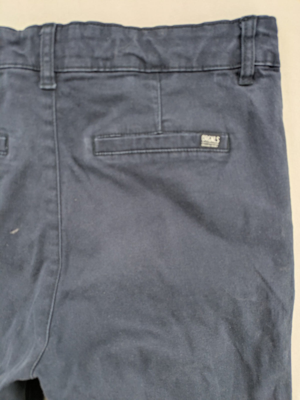H&M navy chino pants with stretch, classic design, soft cotton blend material.