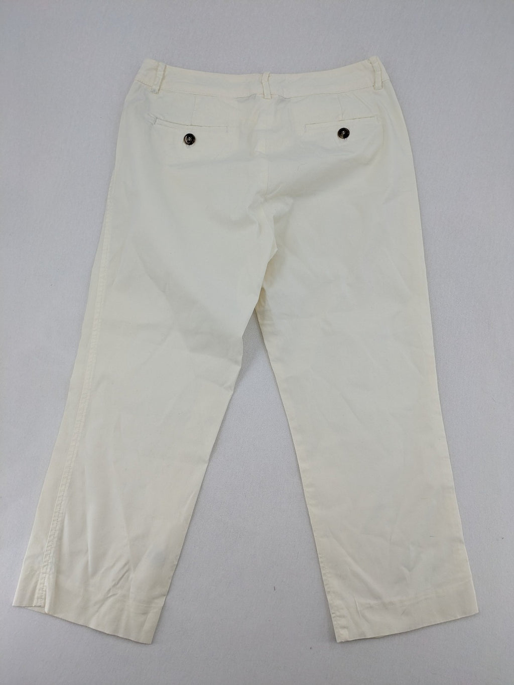 MaxMara cream cropped chino pants with zipper closure, belt loops, and back pockets.