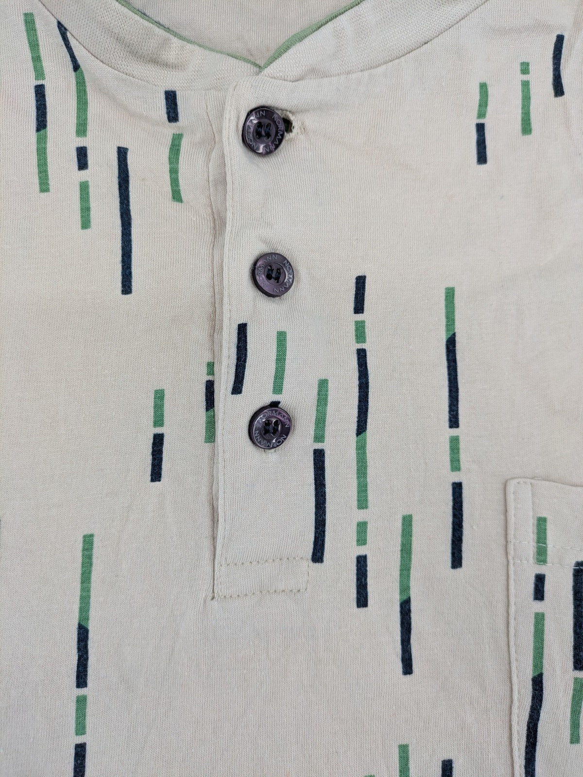 Normann beige striped long sleeve Henley shirt with button placket and chest pocket.