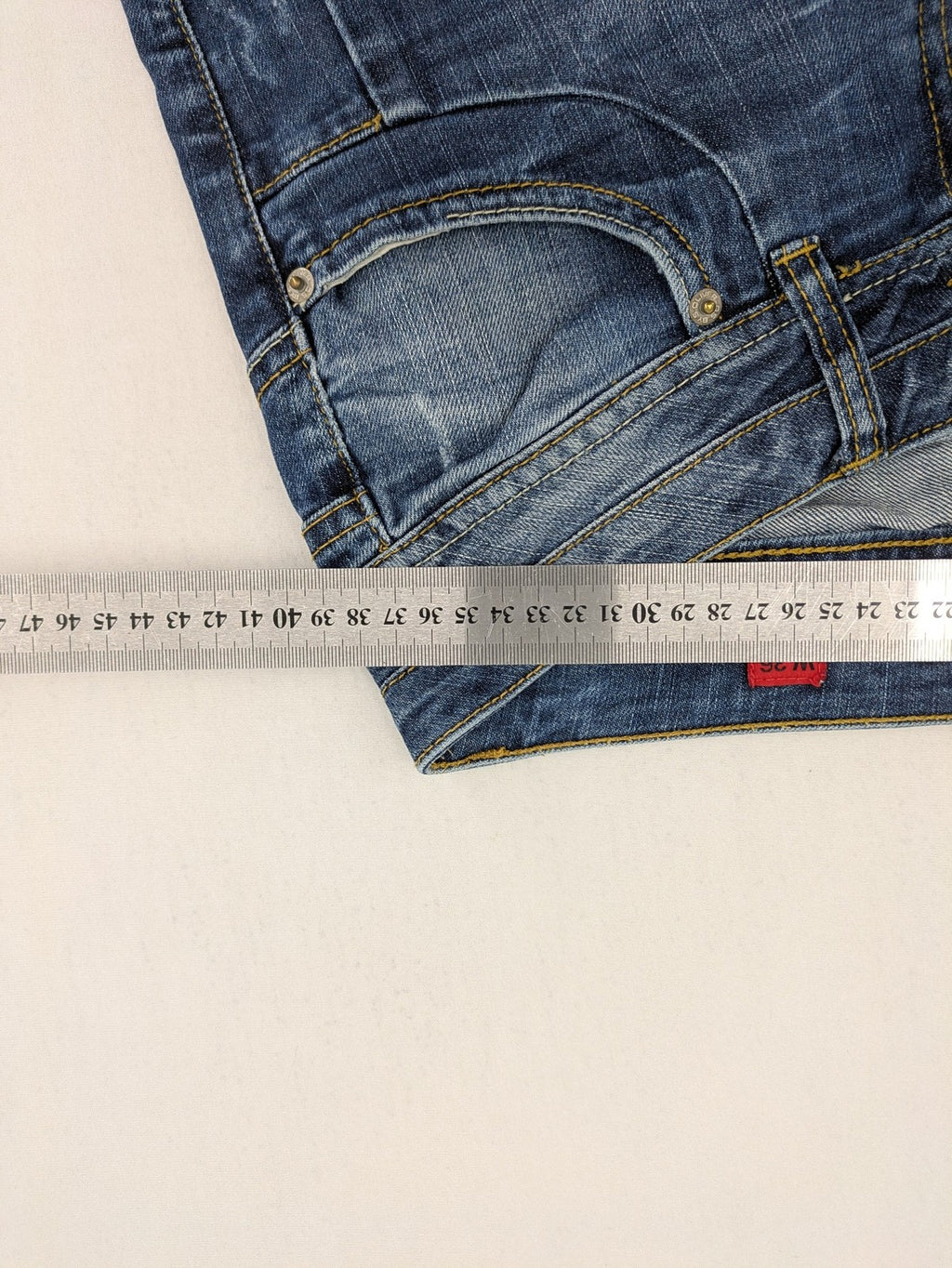 QS by s.Oliver green straight jeans five-pocket design with unique double button closure