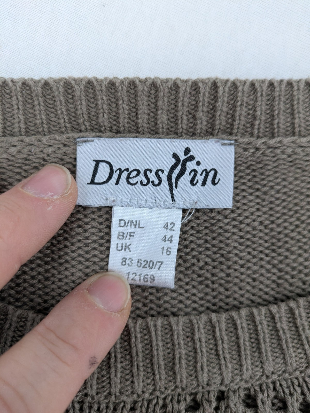 Dressin brown knit jumper with decorative open-knit details and comfortable fit.