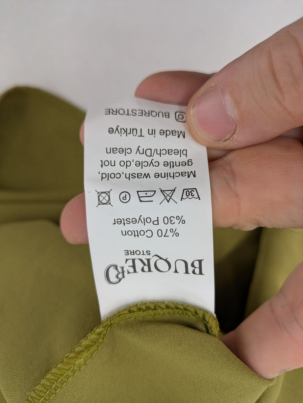 Buqre Store khaki A-line dress with puff sleeves, ruffled cuffs, and button placket.