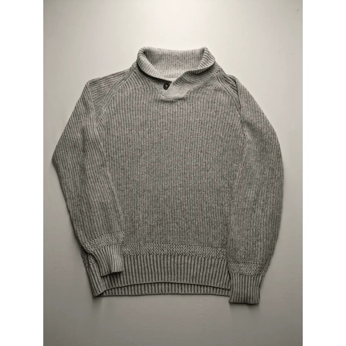Autumn Glow grey turtle neck jumper with ribbed pattern and button detail.