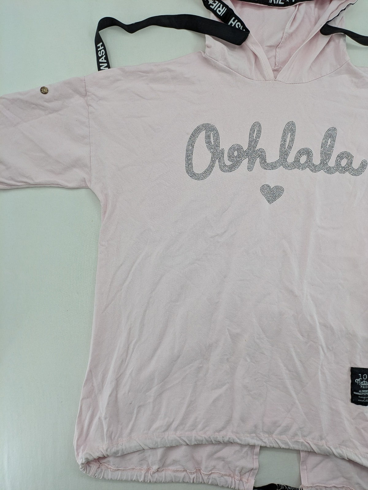Irie pink turtle neck jumper with "Oohlala" rhinestone lettering and logo drawstrings.