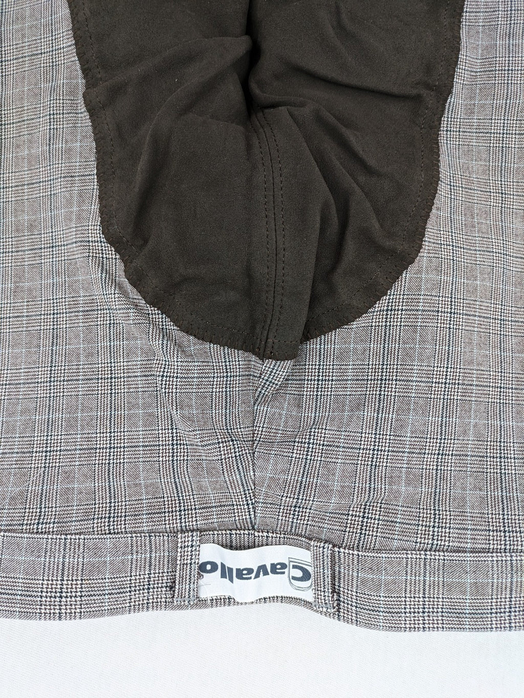 Cavallo grey check riding pants with brown full-seat patch and logo detail.