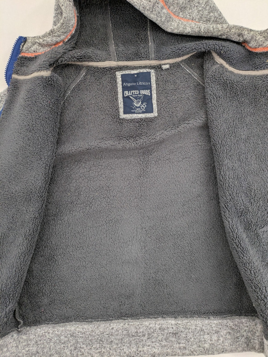 Angelo Litrico grey hoodie with teddy fleece lining, adjustable hood, and retro ski patch.