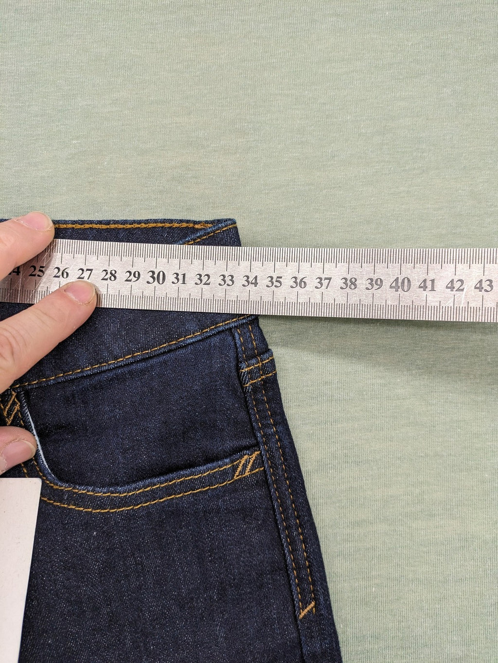 Esprit navy straight jeans with five-pocket style and yellow contrast stitching.