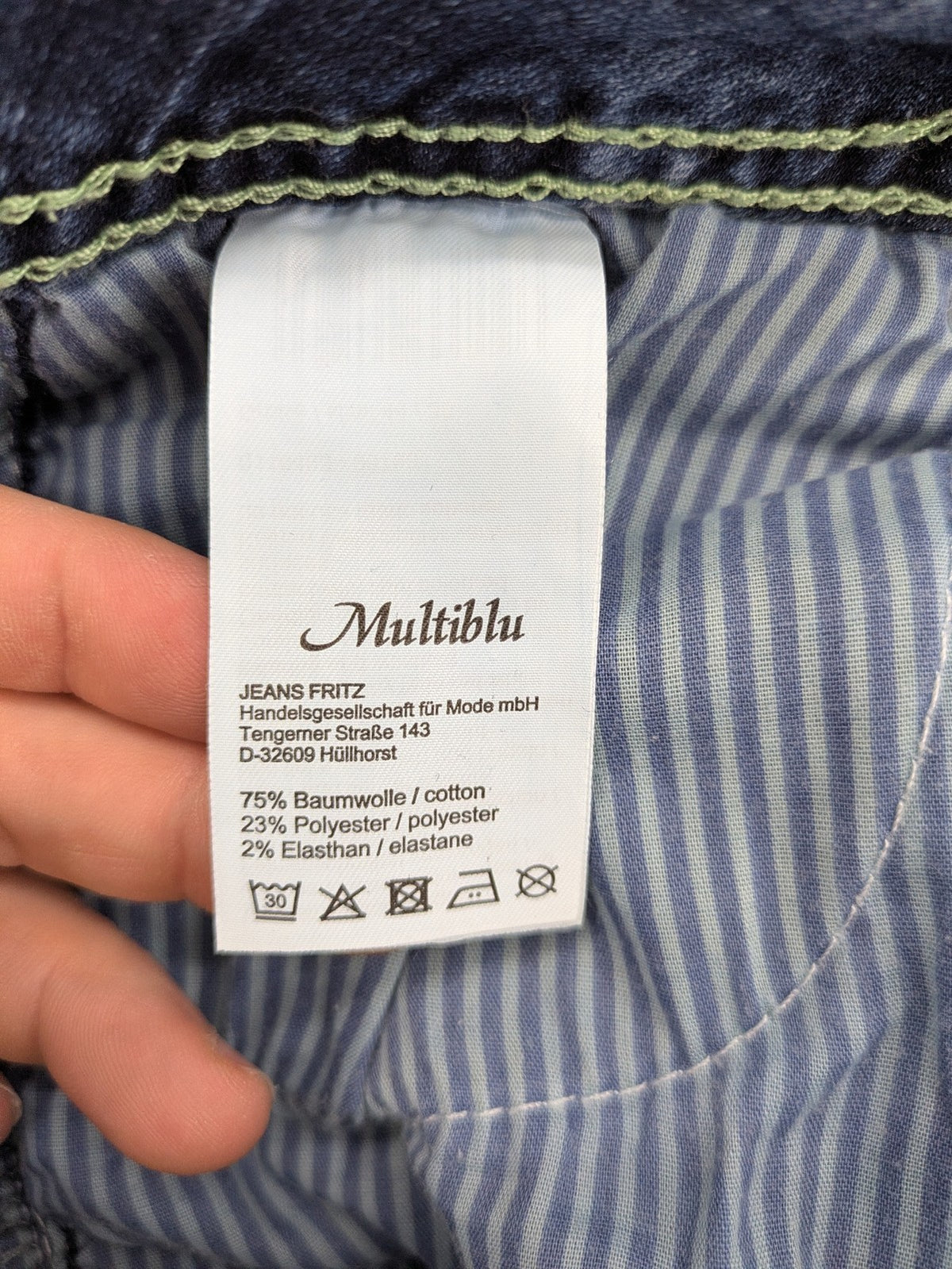 Multiblu blue straight jeans slim fit with decorative front zippers and light wash.
