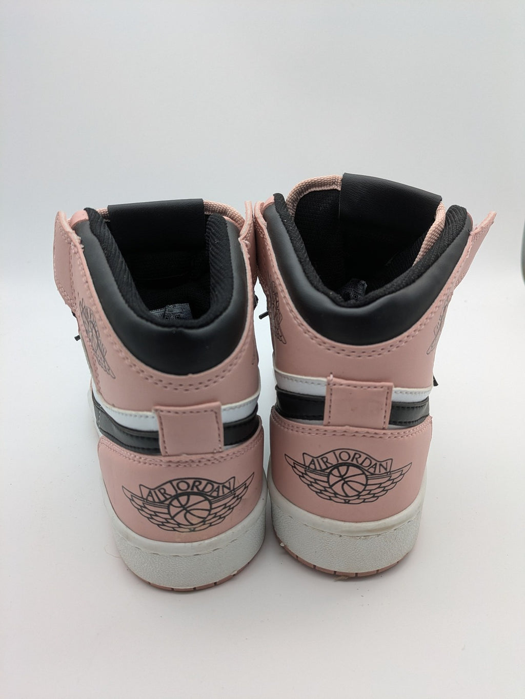 Nike Air Jordan high-top sneakers multi with Wings logo, Jumpman detail, and perforated toe.