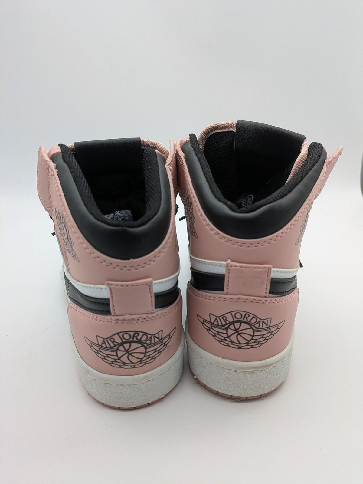 Nike Air Jordan high-top sneakers multi with Wings logo, Jumpman detail, and perforated toe.