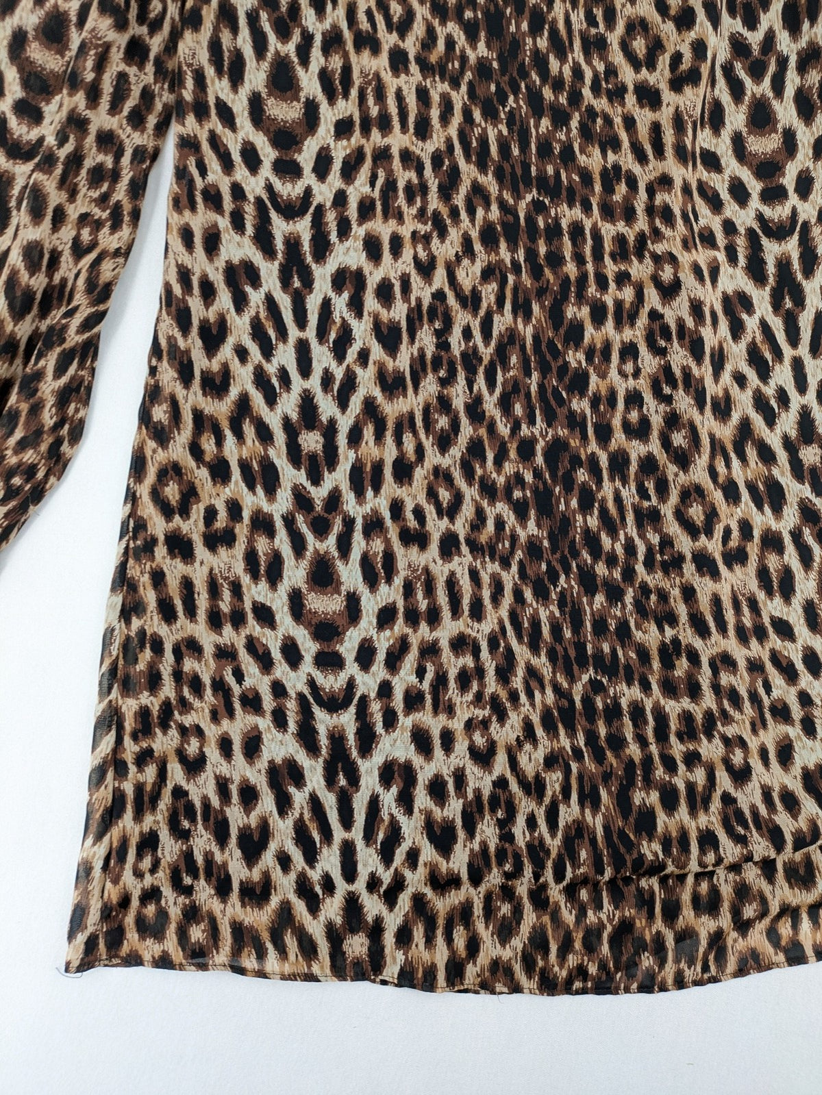 Atmosphere beige leopard print dress with sheer chiffon sleeves and buttoned cuffs.