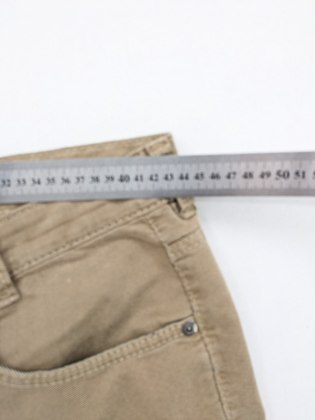 Joker beige straight jeans with double saddle stitching and classic 5-pocket design.