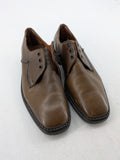Fonda brown deck shoes genuine leather square toe design with decorative stitching.