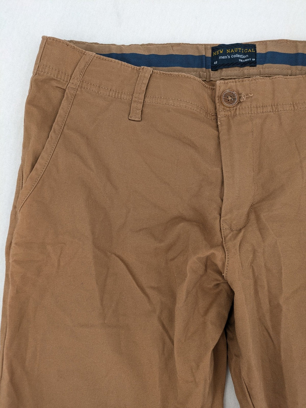 Nautical tan chino pants straight fit cotton blend with subtle anchor print lining.