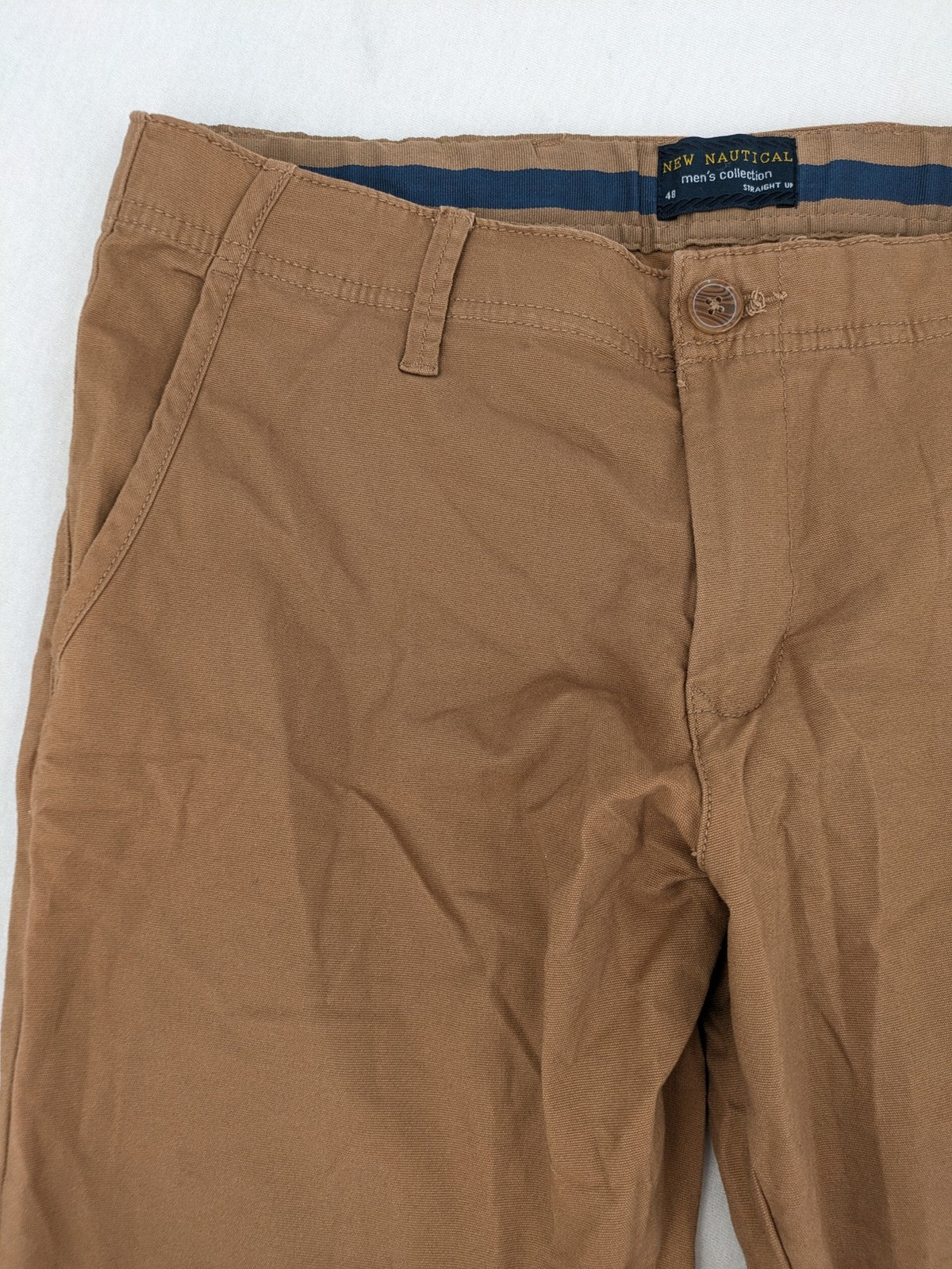 Nautical tan chino pants straight fit cotton blend with subtle anchor print lining.