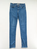 Levi's blue skinny jeans with raw hem, classic five-pocket design, and zip fly.