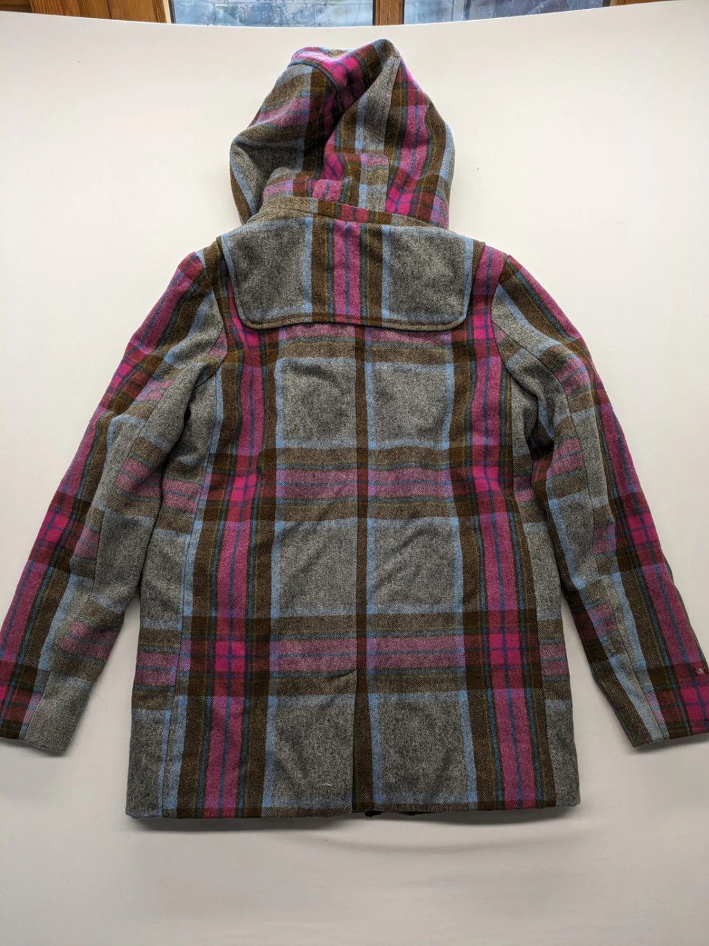 Johnnie B pink coat with gray check pattern, Sherpa lining, and zip closure.