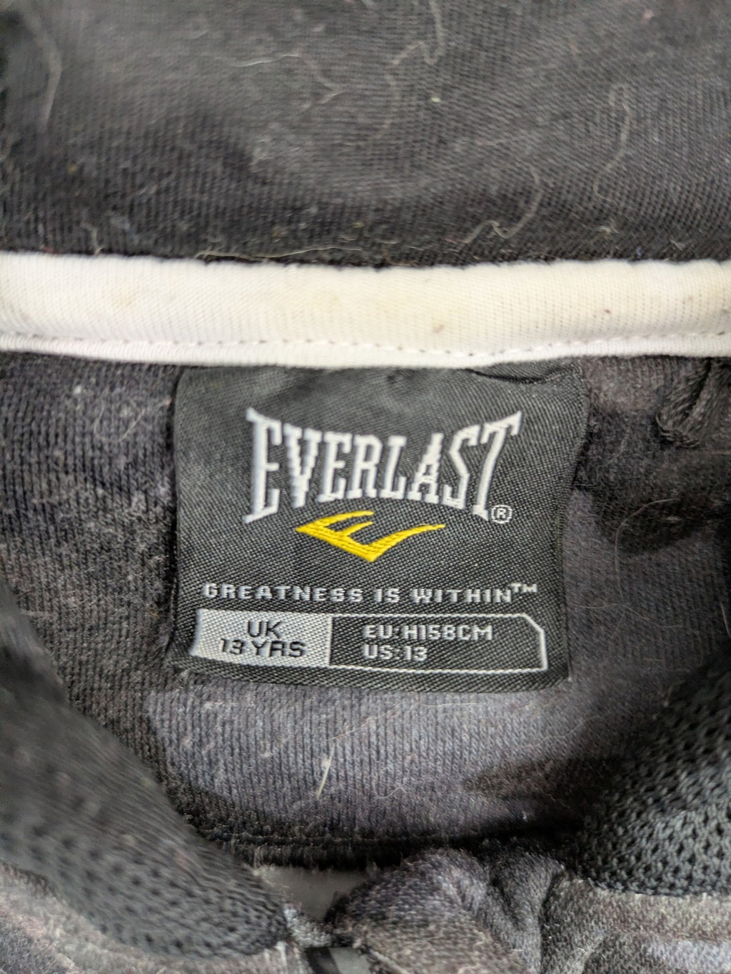 Everlast black grey camouflage jacket with full zip and attached hood.
