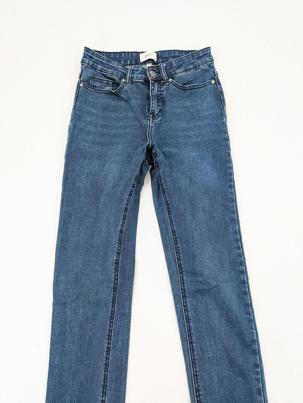 Dust blue skinny jeans with mid-rise waist and classic wash, stretch denim material.
