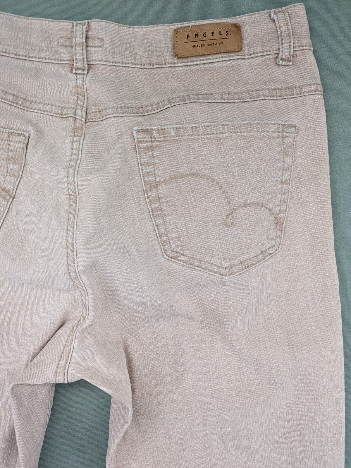 Angels beige straight leg jeans with five-pocket design and zipper button closure.