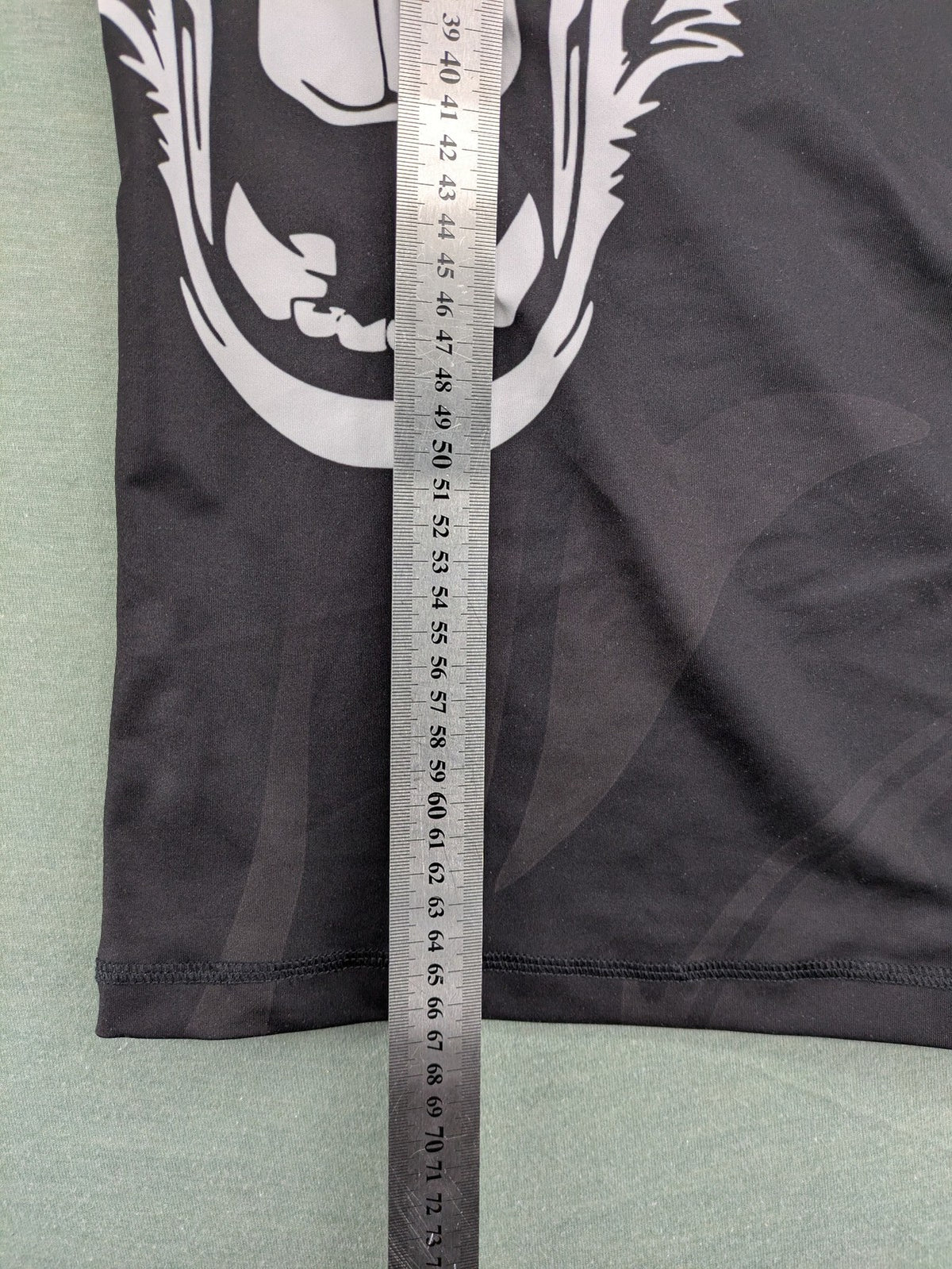 FORMMMA black rashguard featuring striking white wolf graphic and "Chechen Warrior" text.