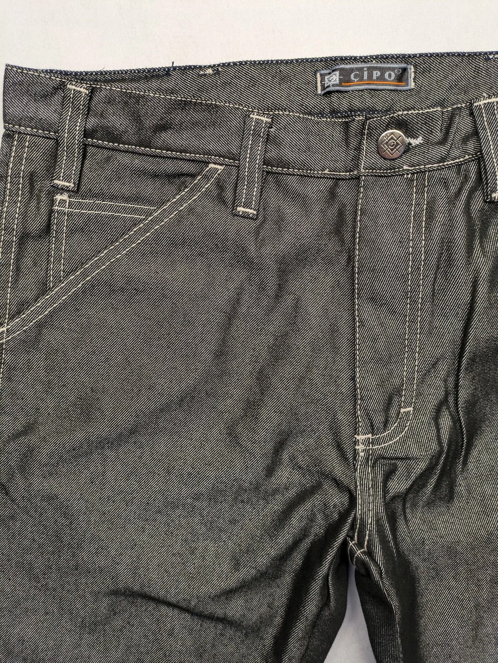 CIPO grey bootcut biker jeans with white contrast stitching and moto-inspired knee pleats.